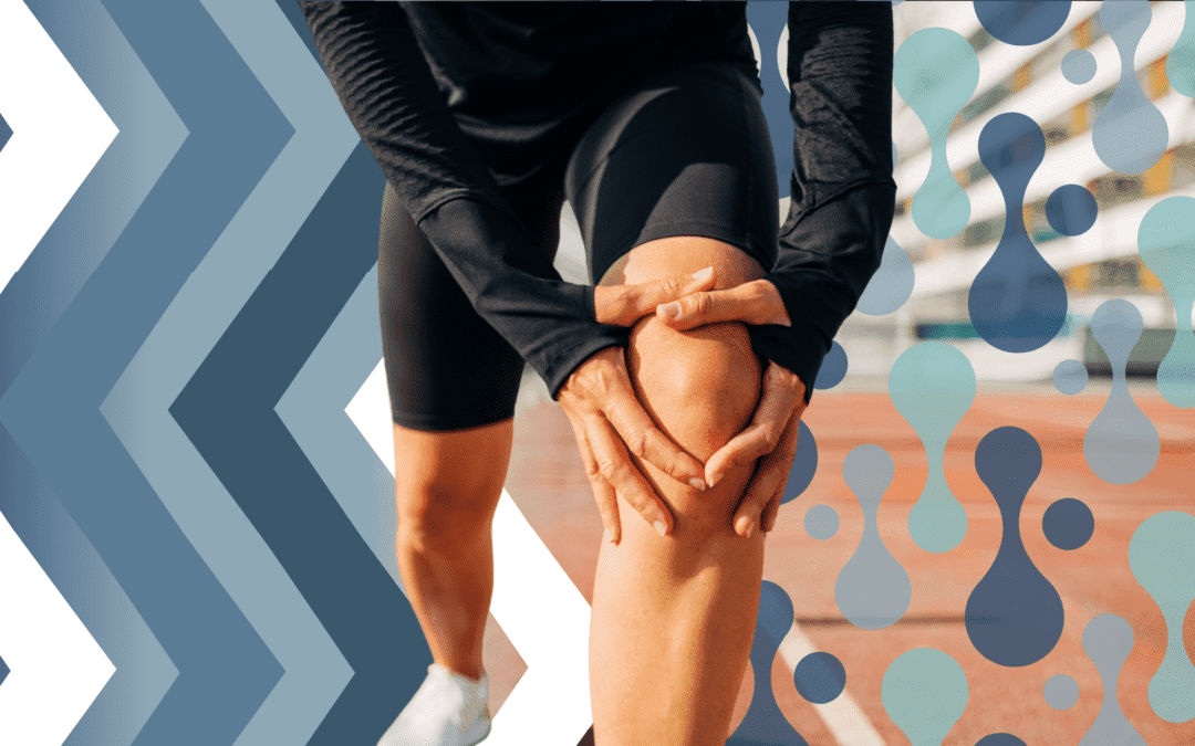 Runner holding their knee on a track, highlighting the importance of chiropractic care in preventing sports injuries.